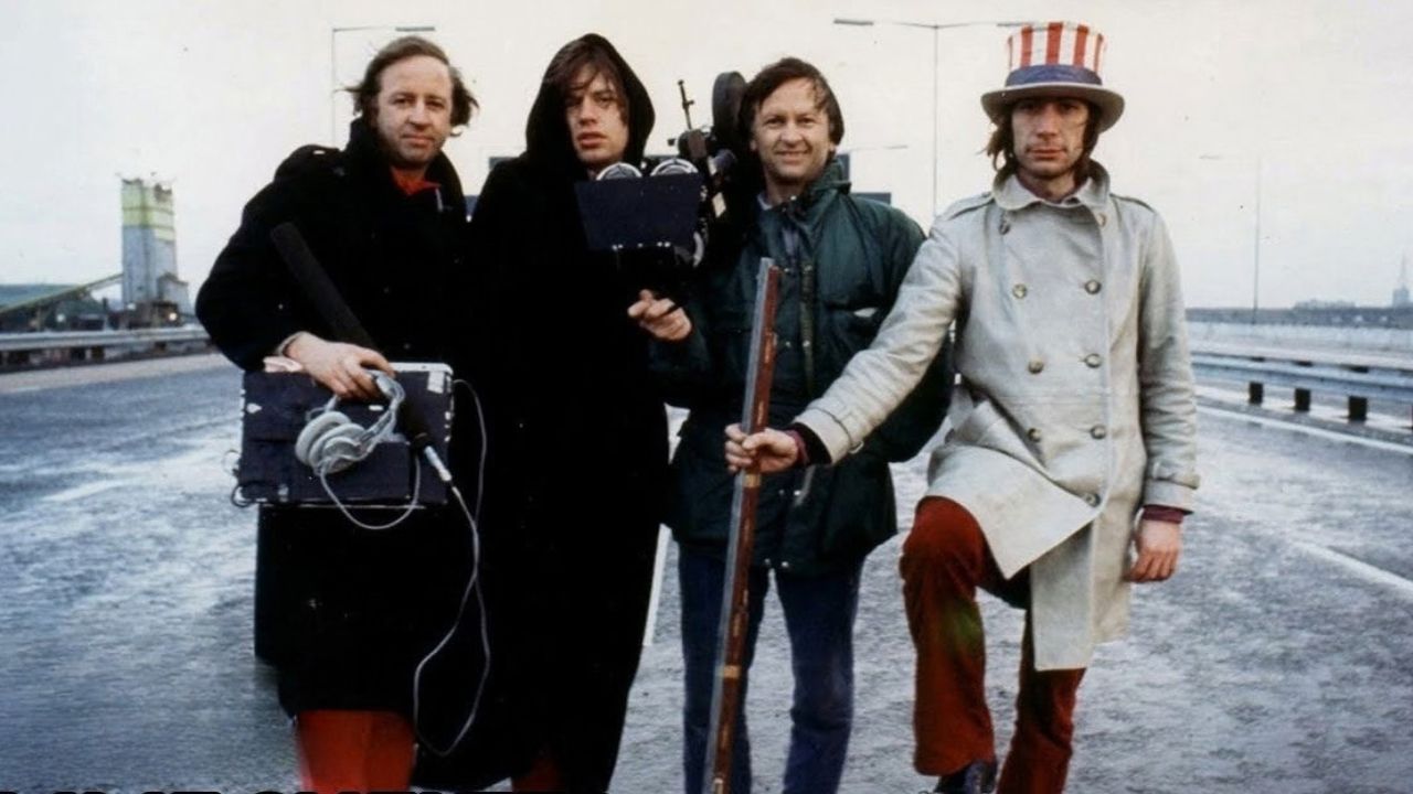 four men with a filmmaking equipment